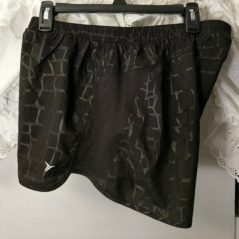 Running shorts, black with reflective black lines